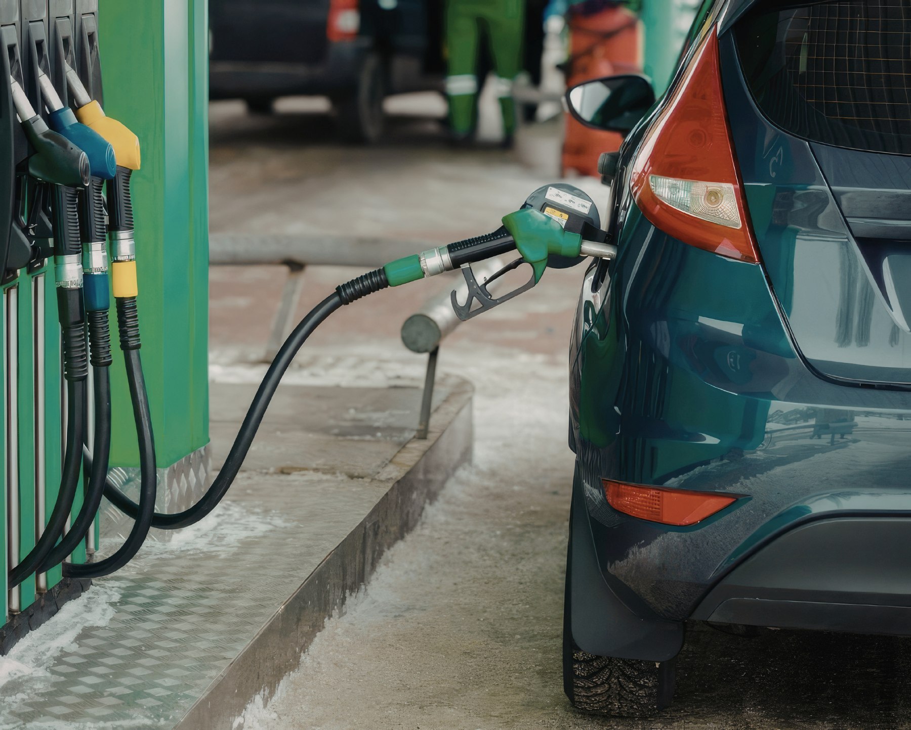 Pumping gas into a green car